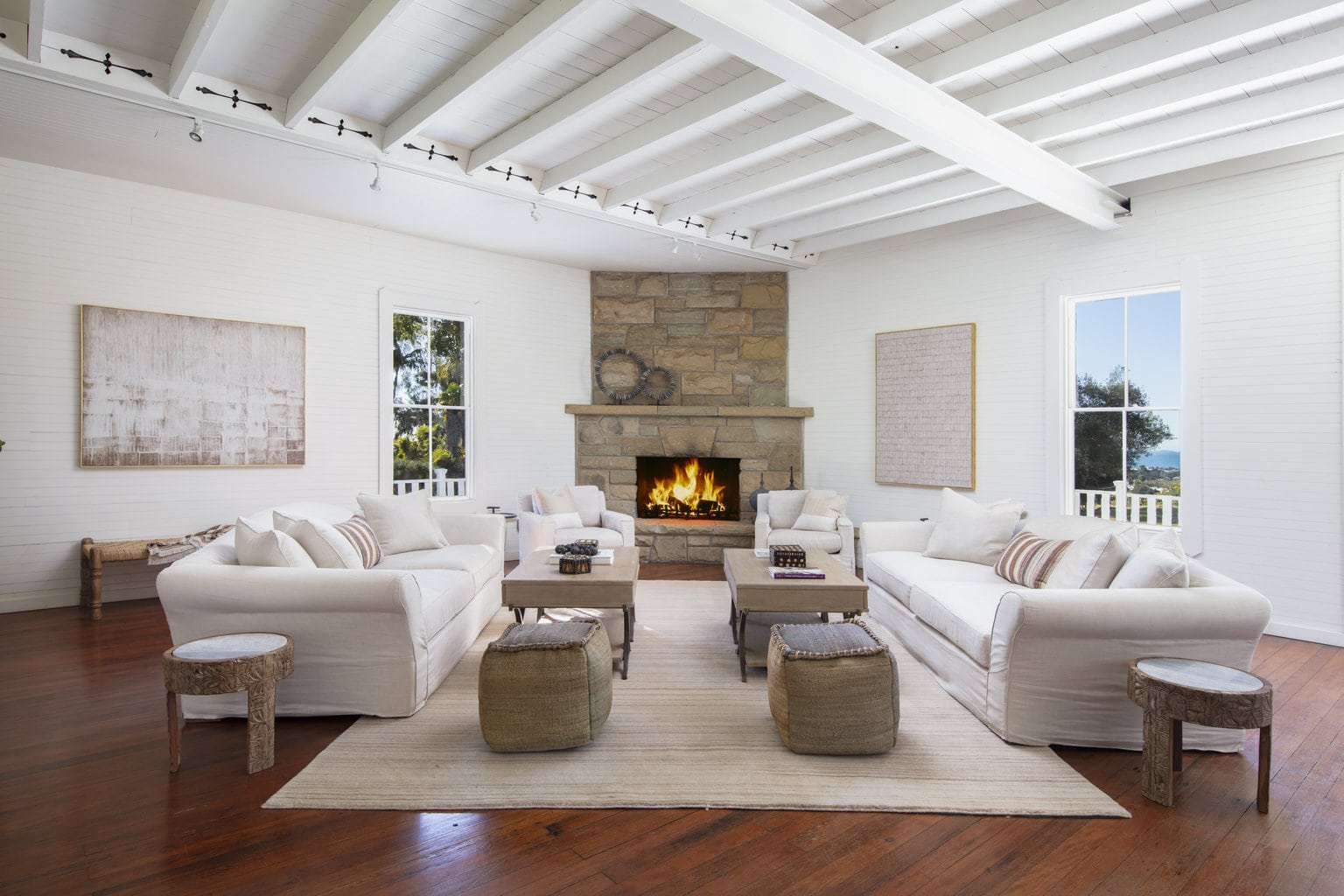 living-room-with-couches-and-grand-fireplace