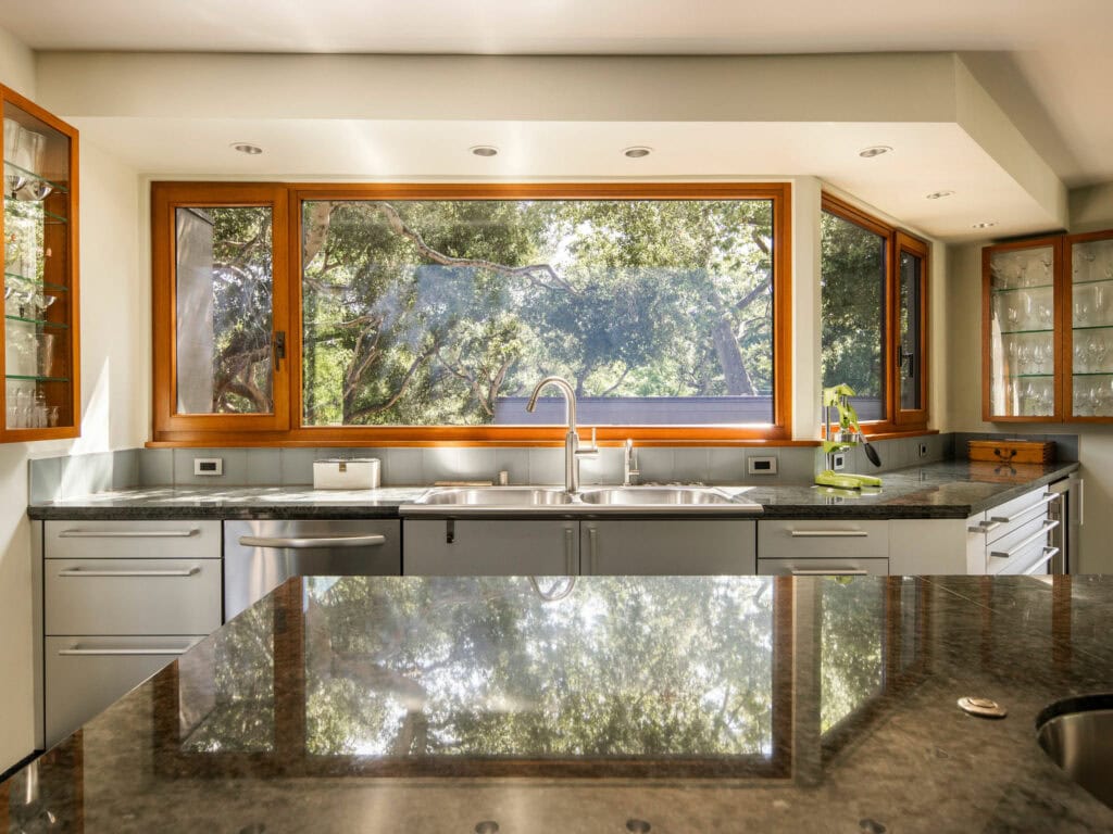 Custom Poggenpohl kitchen at The Erving House featuring European appliances and garden views